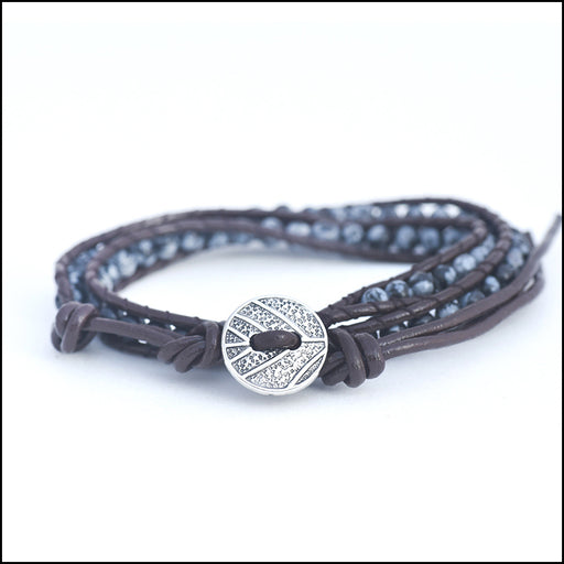 An image of a(n) Snowflake Obsidian - Semi Precious Stones and Leather Wrap Bracelet.