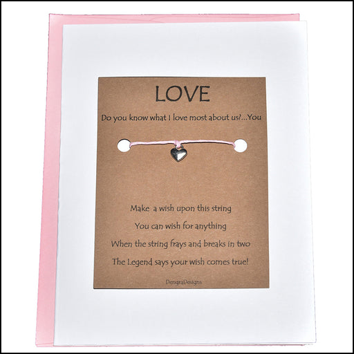 An image of a(n) Love You the Most with Heart Charm Charmed Greetingl.
